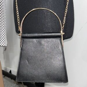 Elegant Black Mini Bag with Gold Accents